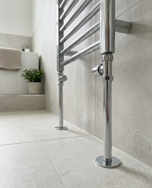15mm Radiator Pipes & Rosettes, chrome in a bright modern bathroom
