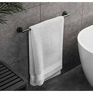 Artisa towel rail in matt black holding a bath towel