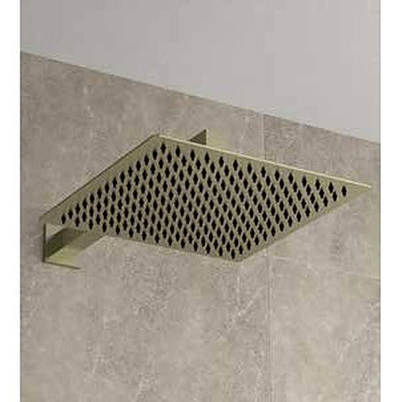Square 250mm shower head on a wall arm in brushed brass