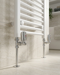 Chrome Thermostatic Radiator Valves, straight thermostatic radiator valves in a bright modern bathroom