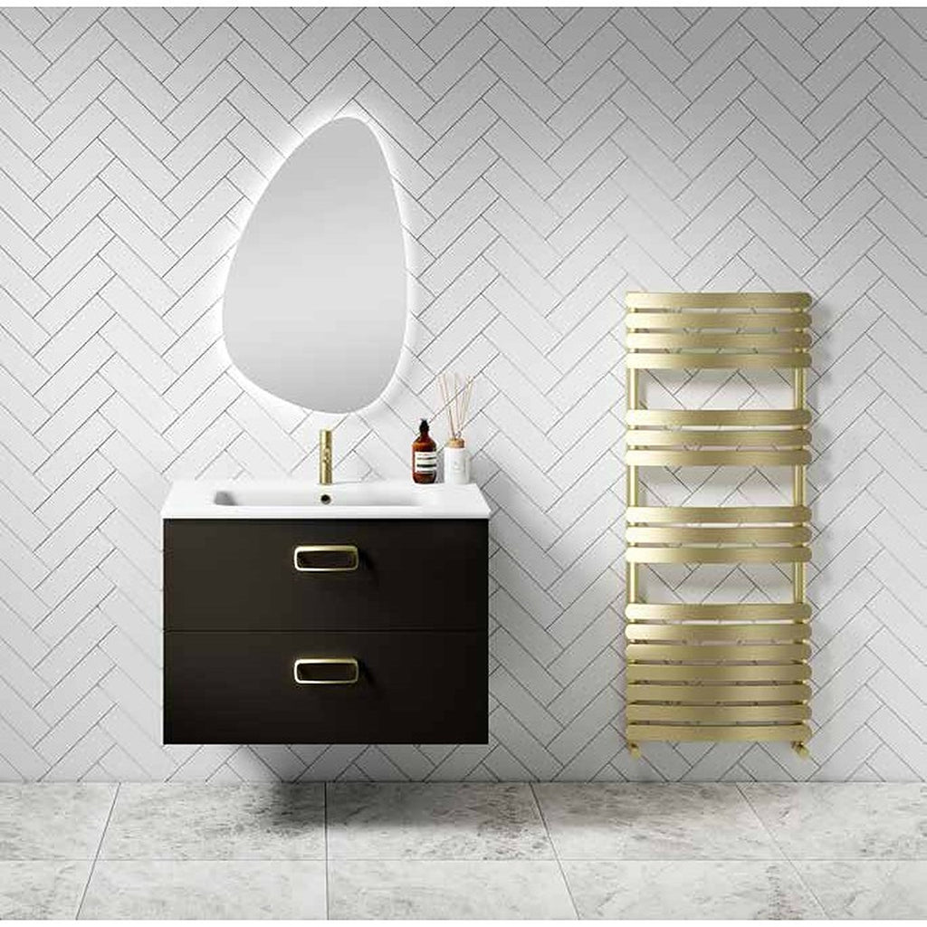 Eclipsa towel radiator in brushed brass beside a vanity unit