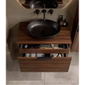 Elipso oval countertop basin in soft black on a walnut vanity unit