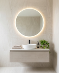 Halia Round Backlit LED Mirror in a bright modern bathroom