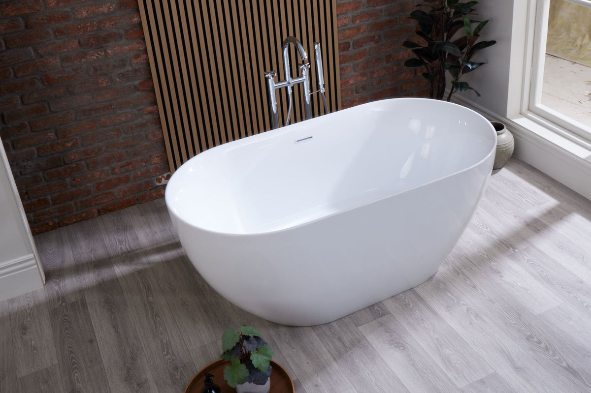 Hettie freestanding bath in a bathroom with brick and timber walls