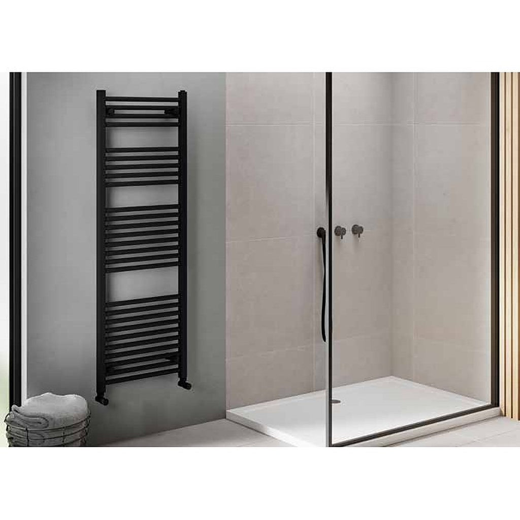 Linea heated towel rail in black beside a walk-in shower