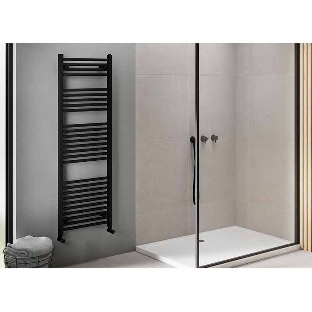 Linea heated towel rail in black beside a walk-in shower