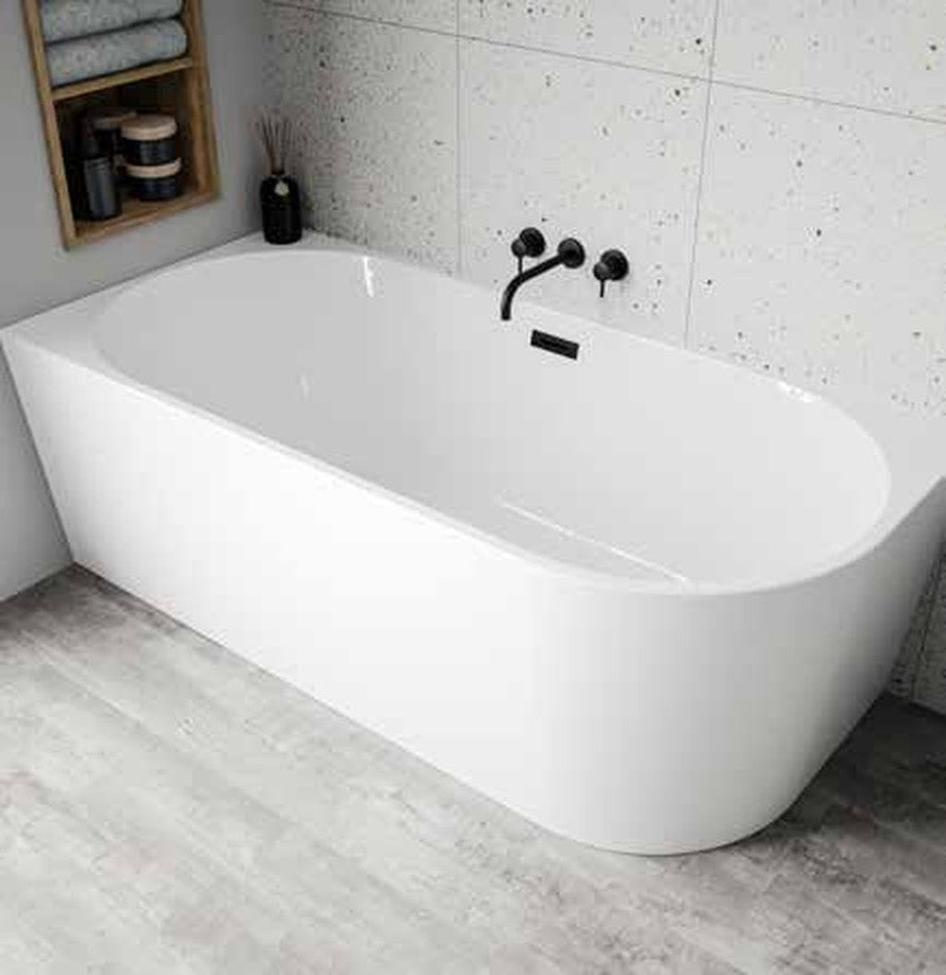 Moda back-to-wall freestanding bath in a bathroom setting