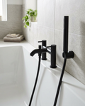 Noxa Round Matt Black Bath Shower Mixer in a bright modern bathroom