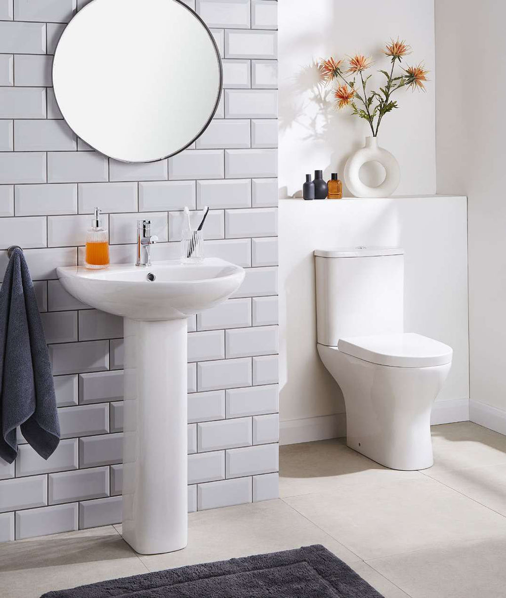 Palma Round Close Coupled Toilet in a bathroom setting