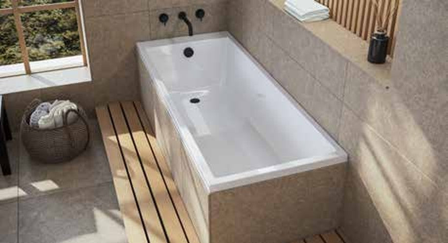 Radia straight bath in a tiled bathroom