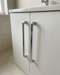 Rowan Furniture Handles, chrome in a bright modern bathroom