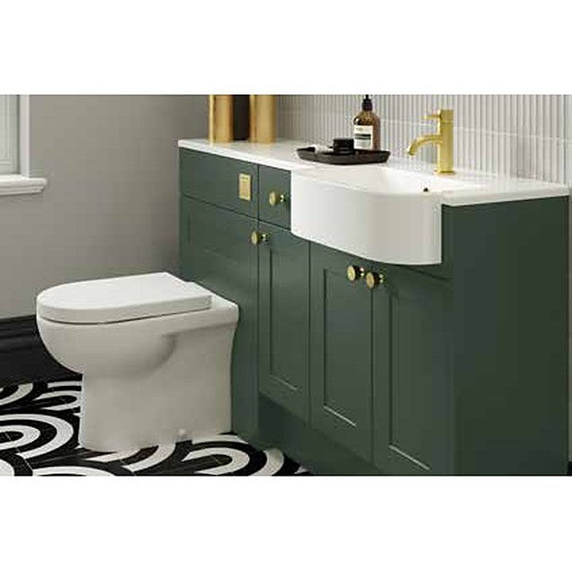 Savora wall hung toilet and semi-recessed basin in a green fitted bathroom