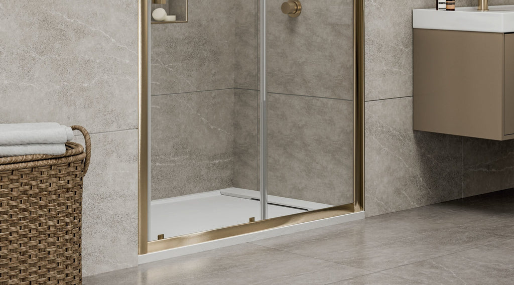 Serina shower tray under a brushed brass walk-in shower screen