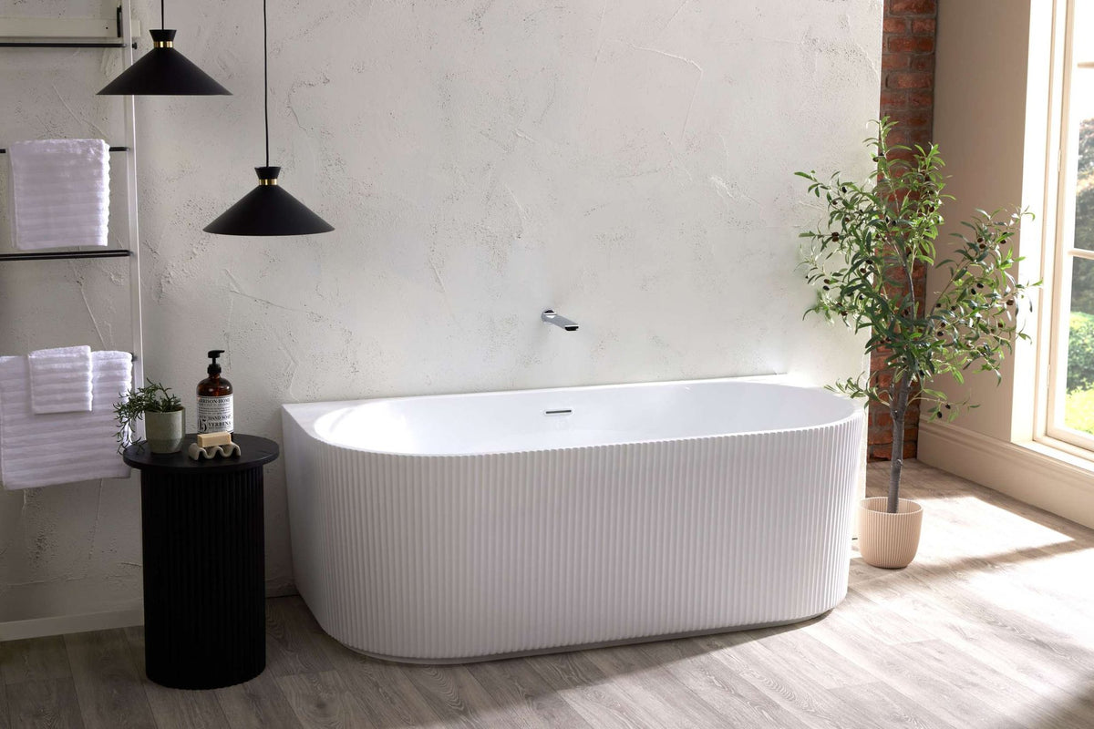 Sofie fluted back-to-wall bath in a bathroom setting